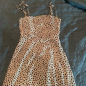 white and black polka dot dress